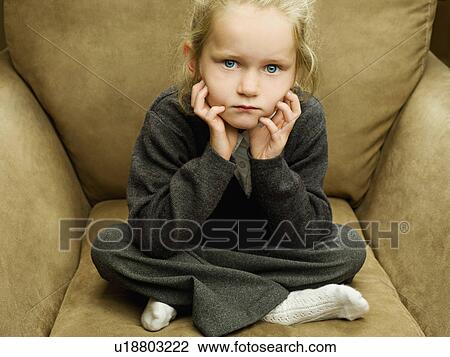 A young girl looking straight to camera View Large Photo Image Stock Image - A young girl looking straight to camera. Fotosearch