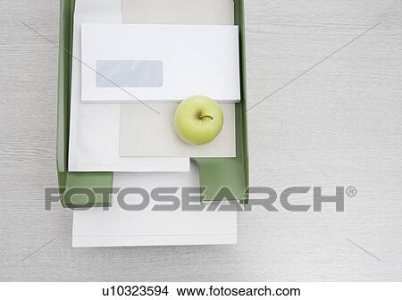 apple in in-tray View Large Photo Image Picture - apple in in-tray. Fotosearch