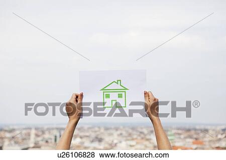 Arms holding paper green house View Large Photo Image Stock Photo - Arms holding paper green house. Fotosearch