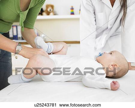 Stock Image - Baby at doctors office. Fotosearch