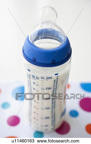 Stock Image - baby bottle with milk. Fotosearch