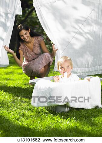 Stock Image - Baby boy in the laundry basket. Fotosearch