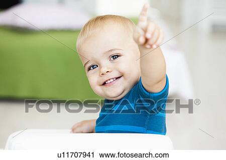Stock Image - baby pointing with his finger. Fotosearch