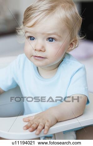 baby sitting in chair View Large Photo Image Stock Image - baby sitting in chair. Fotosearch