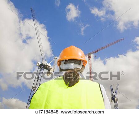 Stock Photo - Back of Woman at Building Site. Fotosearch