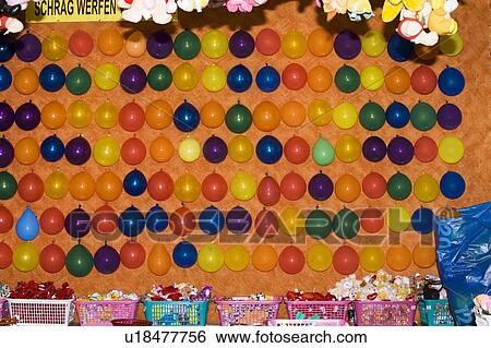 Stock Photograph - Balloons in a shooting gallery. Fotosearch