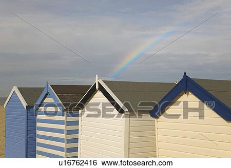 Beach huts with rainbow View Large Photo Image Stock Photograph - Beach huts with rainbow. Fotosearch