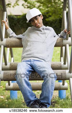 Black Teenager in a park View Large Photo Image Stock Photograph - Black Teenager in a park. Fotosearch