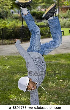 Black Teenager street dancing in park View Large Photo Image Stock Photo - Black Teenager street dancing in park. Fotosearch