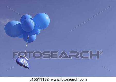 Blue purse flying with balloons View Large Photo Image Stock Image - Blue purse flying with balloons. Fotosearch
