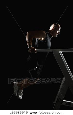 bodybuilder doing triceps dips View Large Photo Image Stock Photo - bodybuilder doing triceps dips. Fotosearch