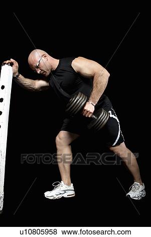 bodybuilder lifting dumbbell View Large Photo Image Stock Photo - bodybuilder lifting dumbbell. Fotosearch