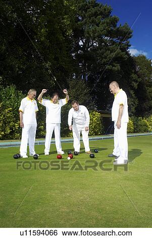 Stock Photograph - bowler and referee. Fotosearch
