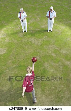 bowler and two people as pins View Large Photo Image Stock Photo - bowler and two people as pins. Fotosearch
