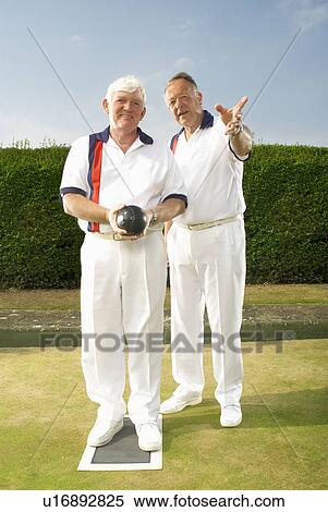 Stock Photography - bowlers discussing tactics. Fotosearch