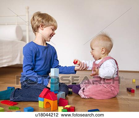 boy and baby with toy building blocks View Large Photo Image Stock Image - boy and baby with toy building blocks. Fotosearch