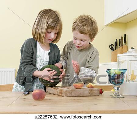 boy and girl preparing fruit View Large Photo Image Stock Image - boy and girl preparing fruit. Fotosearch