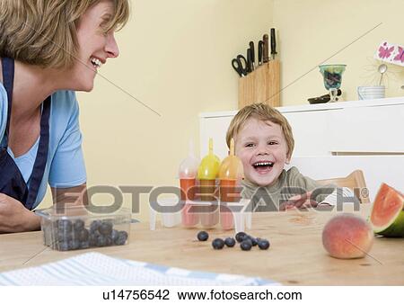 Stock Image - boy and mum laughing. Fotosearch
