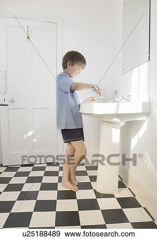 Boy cleaning teeth View Large Photo Image Stock Photo - Boy cleaning teeth. Fotosearch
