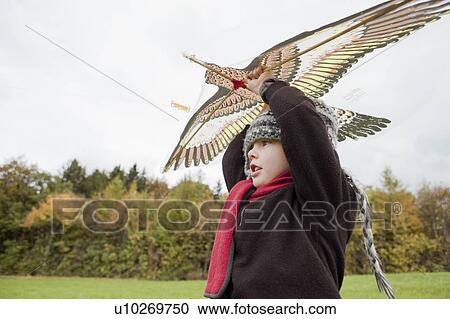 Boy flies a kite View Large Photo Image Stock Image - Boy flies a kite. Fotosearch