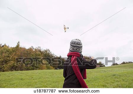 Stock Photo - Boy flies a kite. Fotosearch
