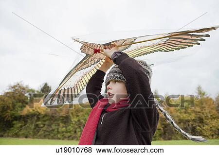 Boy flies a kite View Large Photo Image Stock Photo - Boy flies a kite. Fotosearch
