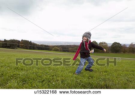 Boy fly a kite View Large Photo Image Stock Photo - Boy fly a kite. Fotosearch