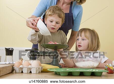 boy, girl and mum making buns View Large Photo Image Stock Photography - boy, girl and mum making buns. Fotosearch