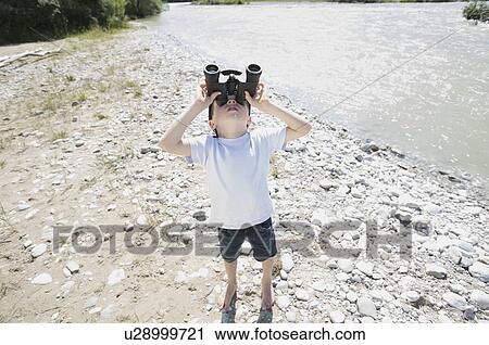 boy looking through field glasses View Large Photo Image Stock Image - boy looking through field glasses. Fotosearch