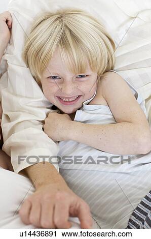 boy lying in bed View Large Photo Image Stock Image - boy lying in bed. Fotosearch