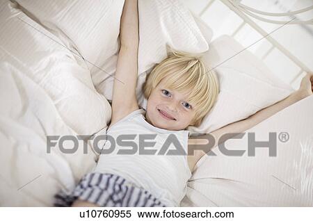 boy lying in bed View Large Photo Image Stock Photography - boy lying in bed. Fotosearch