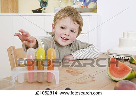 boy making fruit lollies View Large Photo Image Picture - boy making fruit lollies. Fotosearch