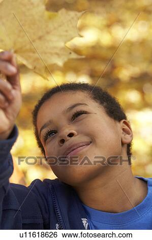 Stock Photograph - boy outside. Fotosearch