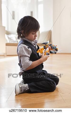 boy playing with toy View Large Photo Image Stock Image - boy playing with toy. Fotosearch
