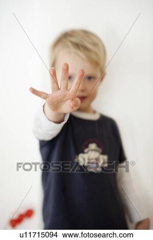 Boy pointing four fingers View Large Photo Image Picture - Boy pointing four fingers. Fotosearch