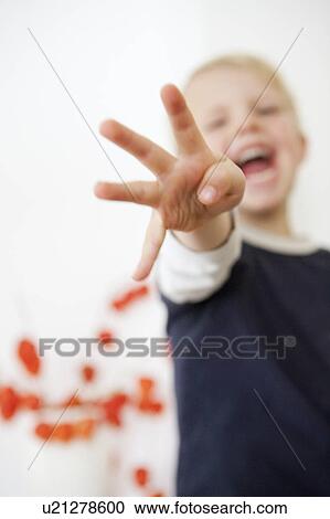 Boy pointing four fingers View Large Photo Image Stock Image - Boy pointing four fingers. Fotosearch