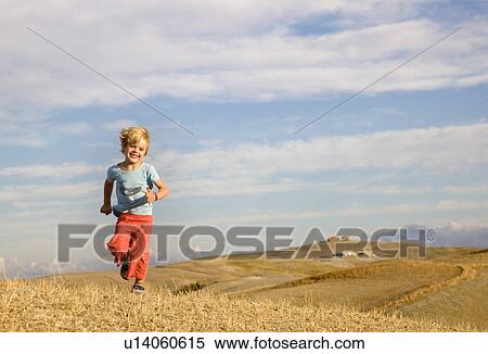 boy running across field View Large Photo Image Stock Photography - boy running across field. Fotosearch