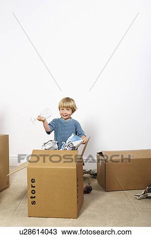 Boy unpacking glasses from box View Large Photo Image Stock Image - Boy unpacking glasses from box. Fotosearch