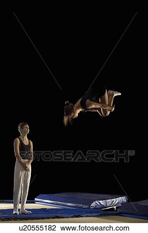 boy watching girl on trampoline View Large Photo Image Stock Image - boy watching girl on trampoline. Fotosearch