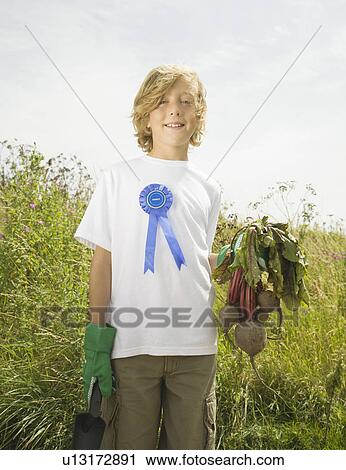 Boy winning produce growing competition View Large Photo Image Stock Image - Boy winning produce growing competition. Fotosearch