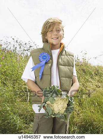 Boy winning produce growing competition View Large Photo Image Stock Photo - Boy winning produce growing competition. Fotosearch