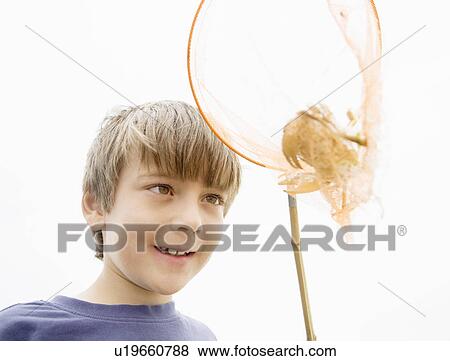 Boy with crab in net View Large Photo Image Stock Photo - Boy with crab in net. Fotosearch