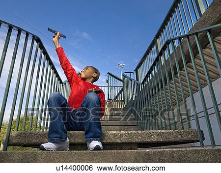 Boy with solar panel View Large Photo Image Stock Photograph - Boy with solar panel. Fotosearch