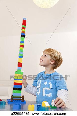 Stock Photography - boy with toy building blocks. Fotosearch