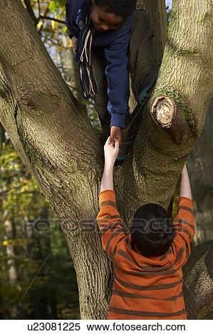 Stock Photography - boys playing outdoors. Fotosearch