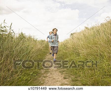 Boys running down path View Large Photo Image Stock Photo - Boys running down path. Fotosearch