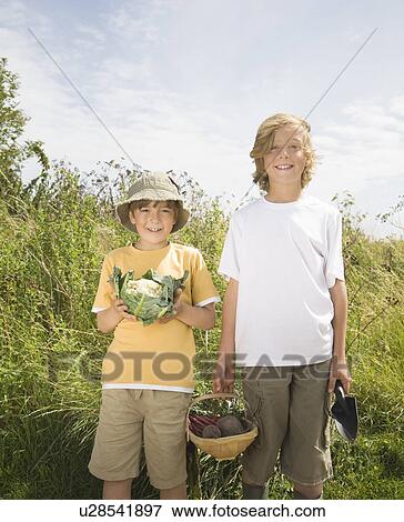 Stock Photo - Boys with vegetables. Fotosearch