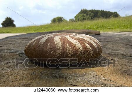 Bread on a stone in beautiful landscape View Large Photo Image Stock Image - Bread on a stone in beautiful landscape. Fotosearch