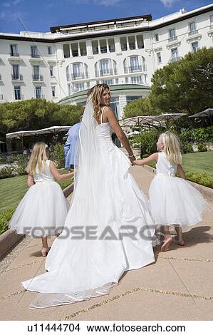 bride and children walk down path View Large Photo Image Picture - bride and children walk down path. Fotosearch