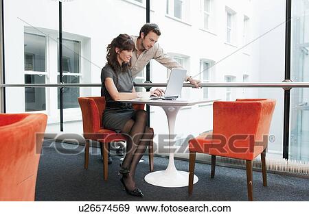 Stock Photo - Business couple in a restaurant. Fotosearch
